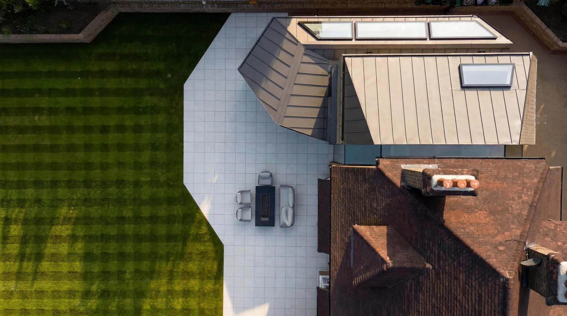 Aerial view of a house roof and garden