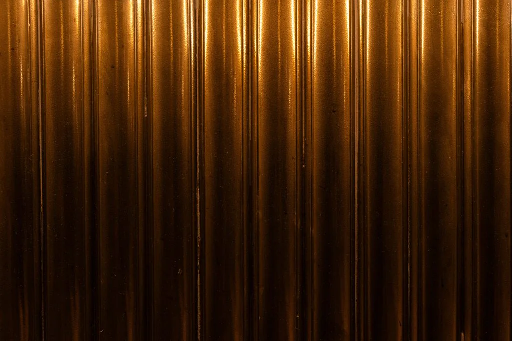 Close-up of a fluted brass wall panel