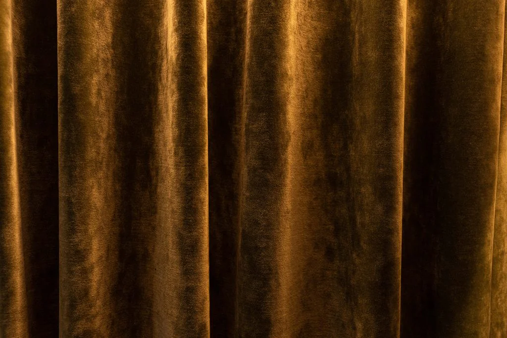 Detail of gold velvet curtain folds