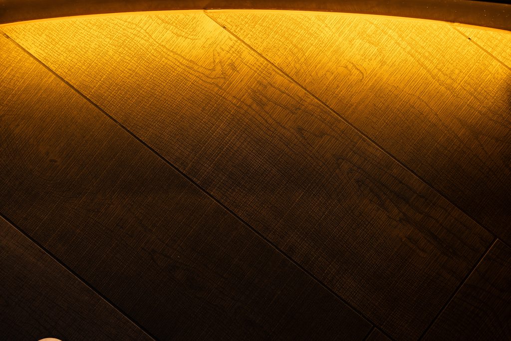 Oak panelling detail under a warm downlight