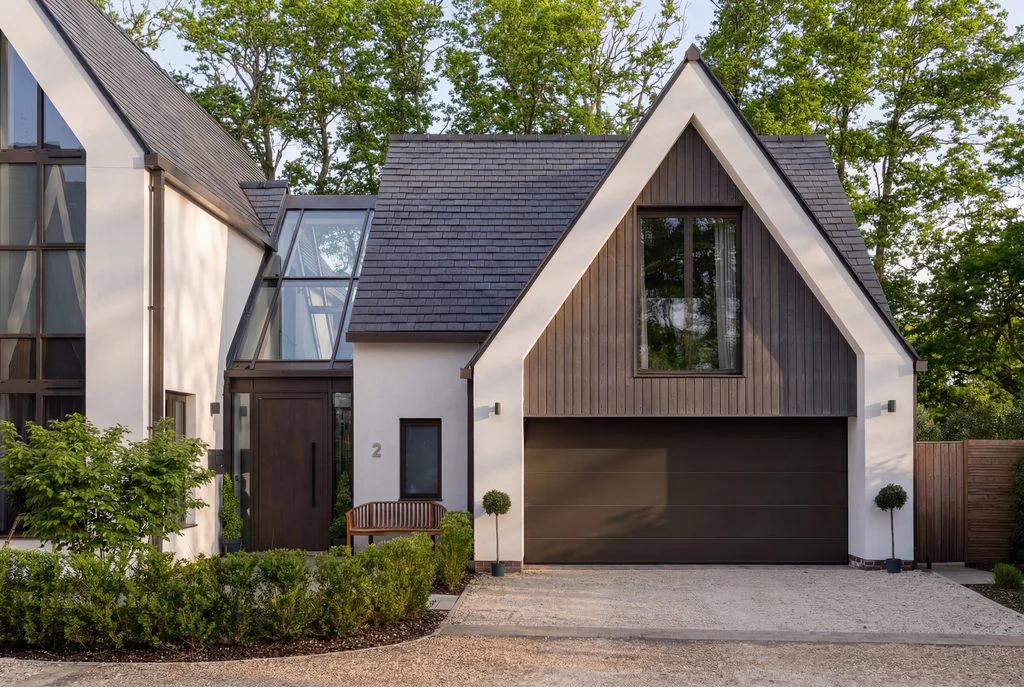 Contemporary gabled house with glazed facade and garage