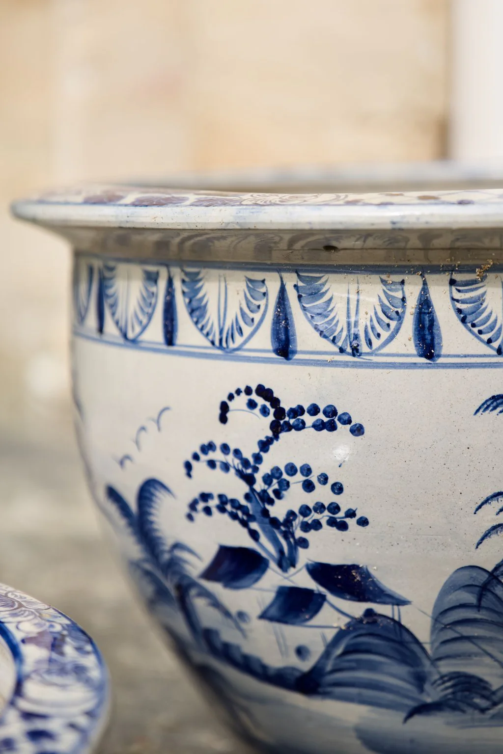 Close-up of a blue and white glazed garden planter
