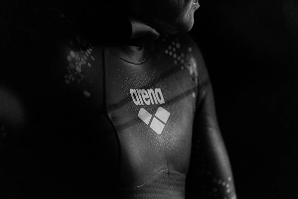 Swimmer in a wetsuit, black and white detail
