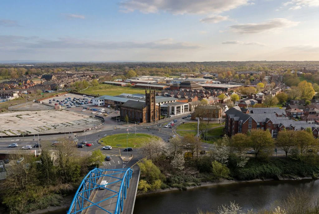 Aerial view of a river bridge and town