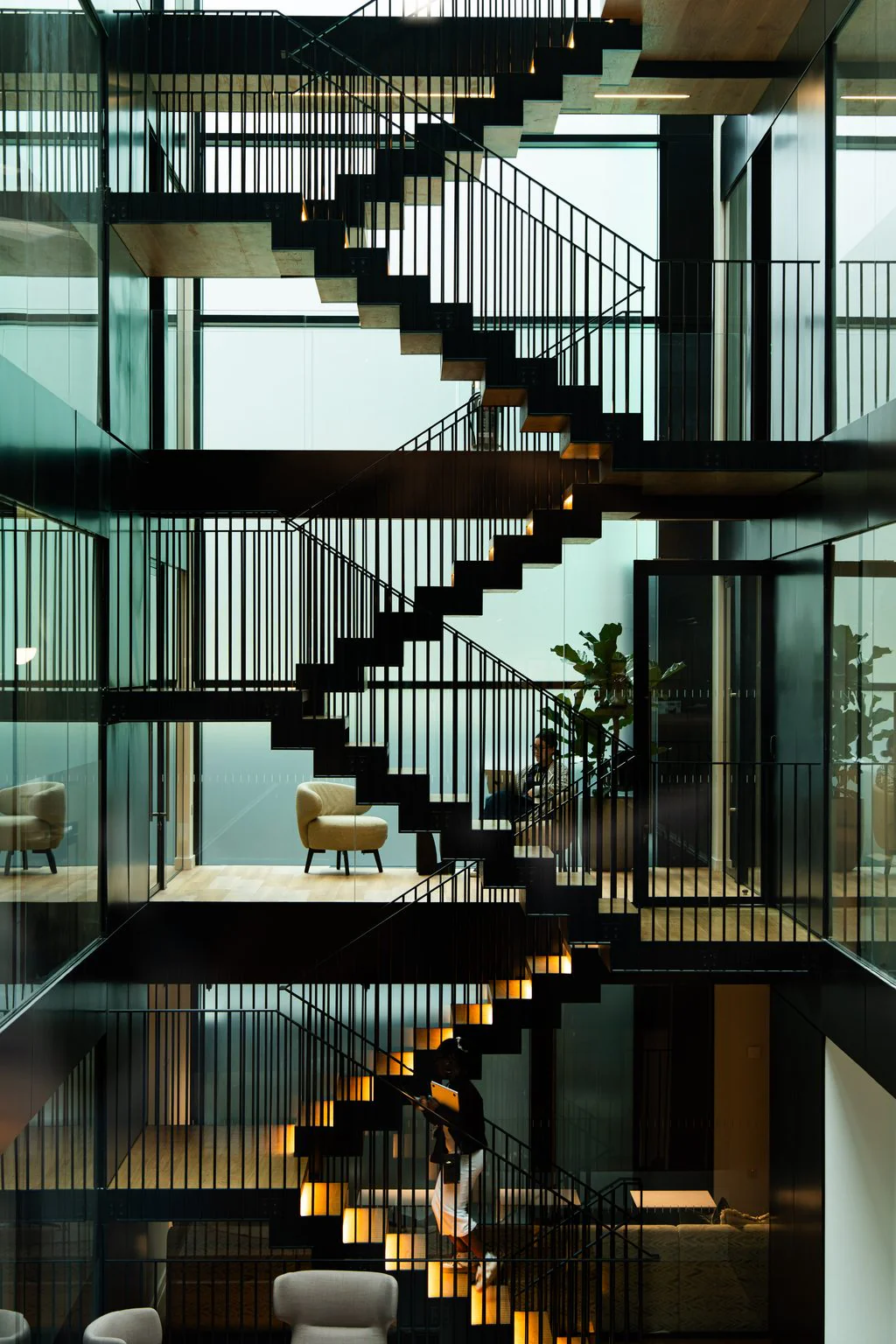Glass-walled staircase atrium in a modern office