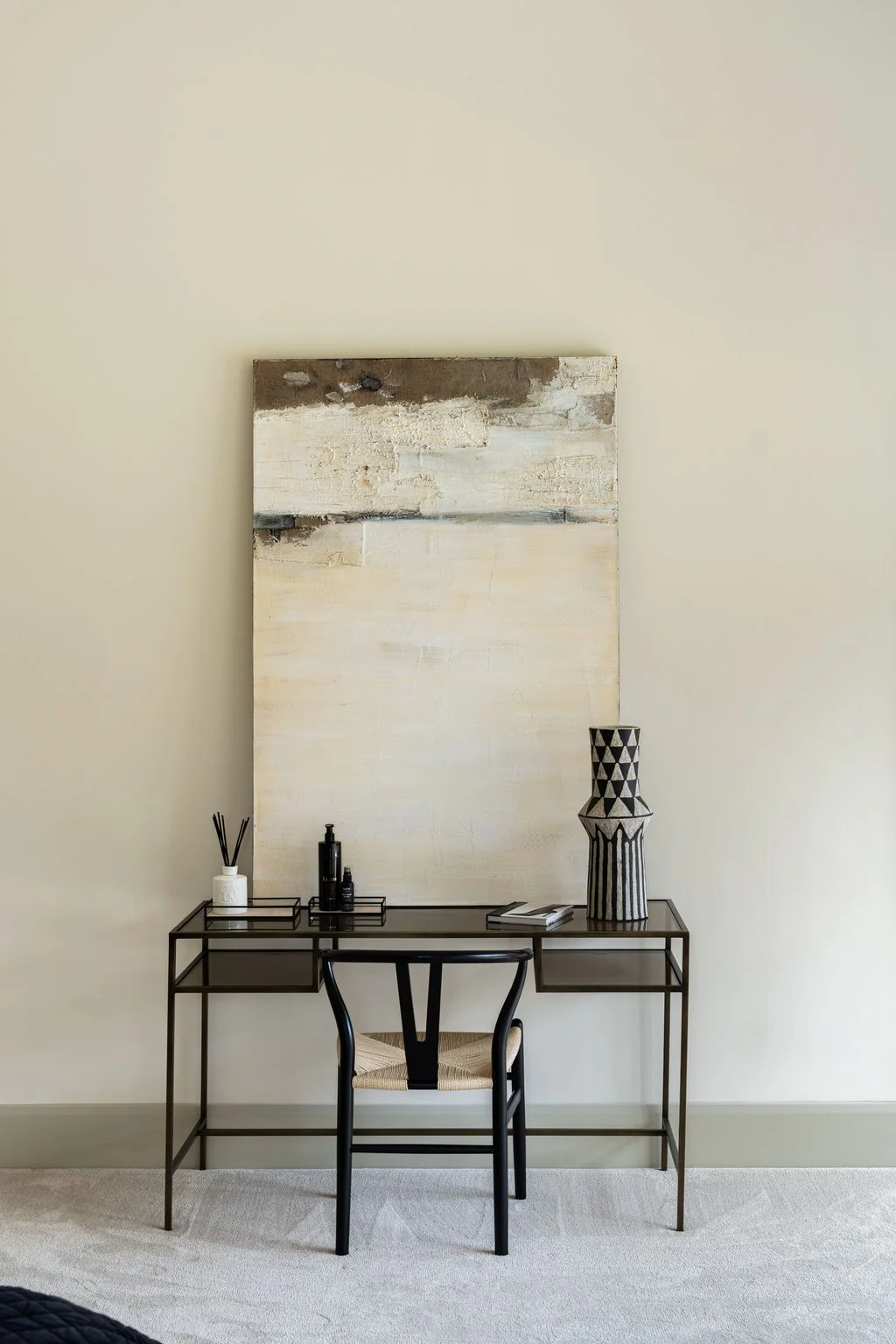 Console table with artwork and ceramics