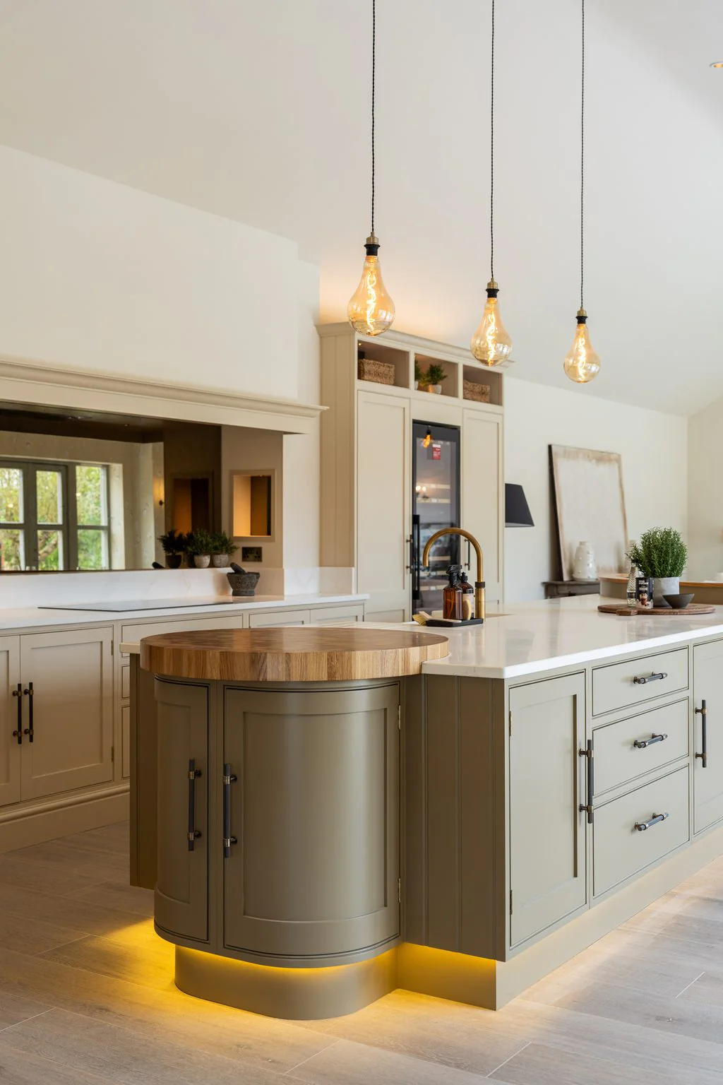 Kitchen with curved island and pendant lights