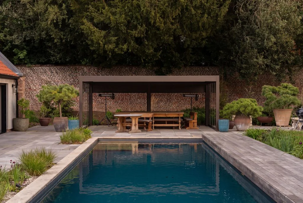 Garden swimming pool with pergola