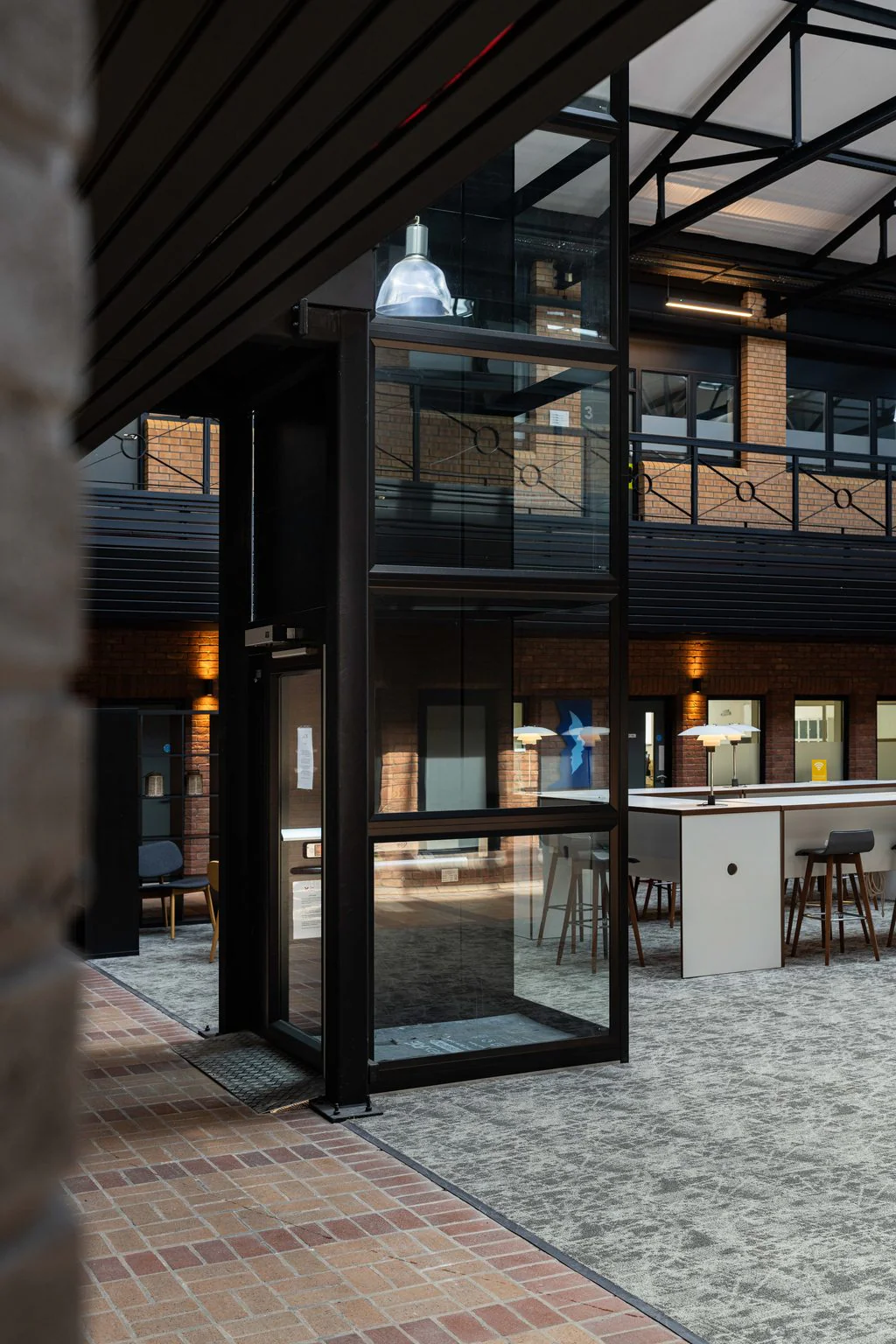 Doorway into a glazed office atrium