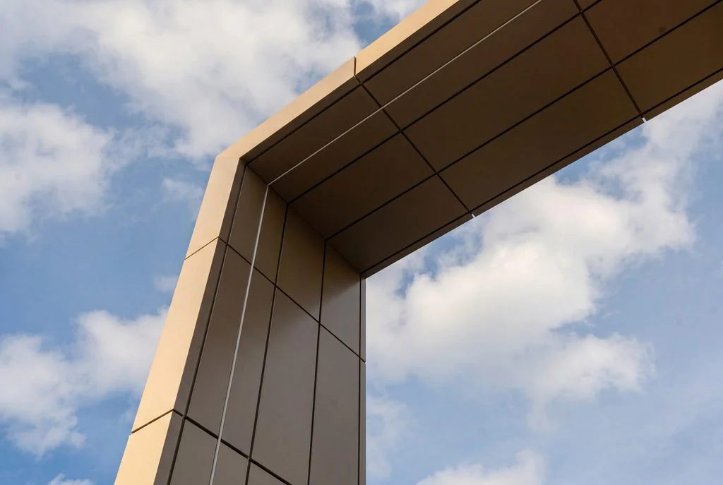 Angular metal-clad facade against blue sky