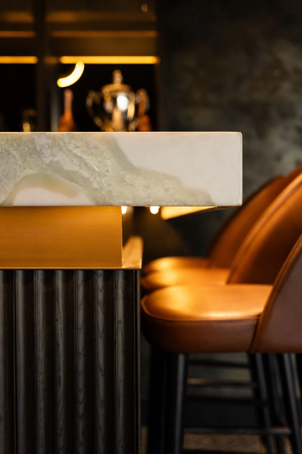 Bar counter detail with leather stools