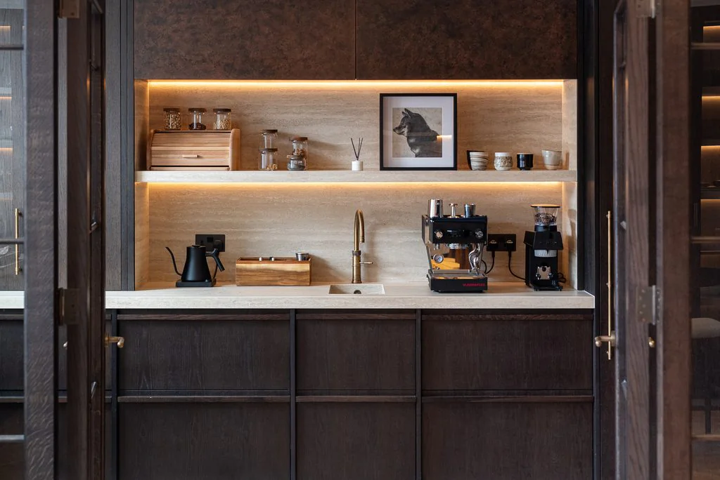 Fitted coffee station in dark oak cabinetry