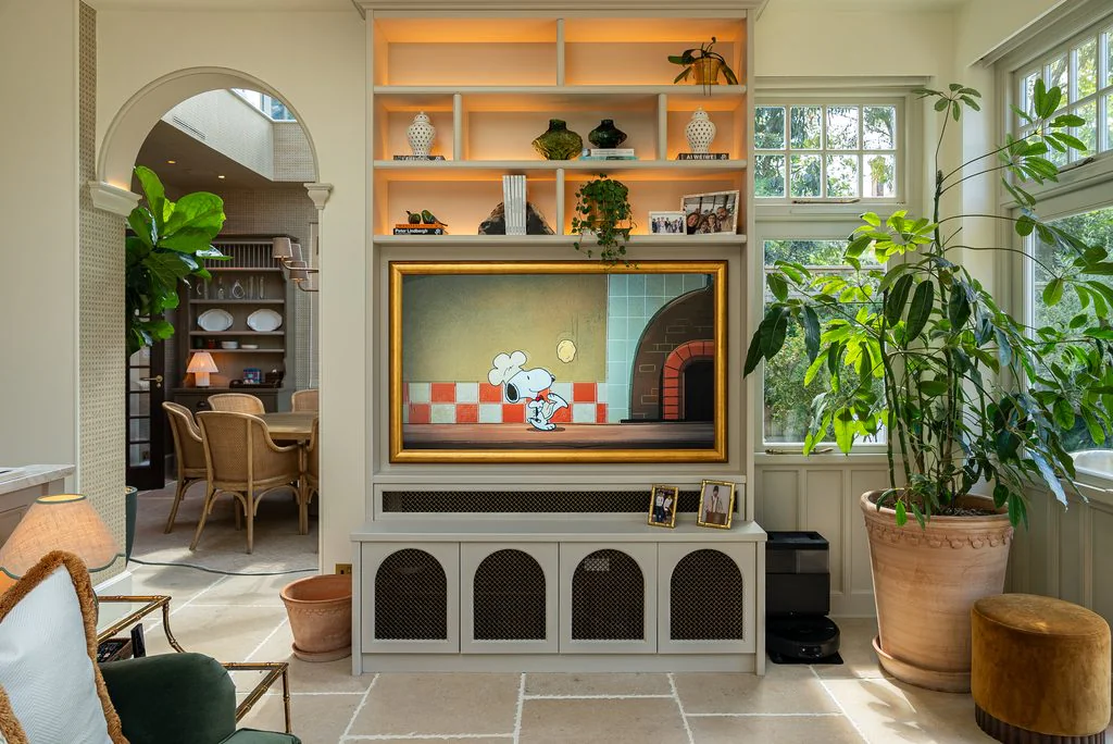 Living room with arched alcove and artwork