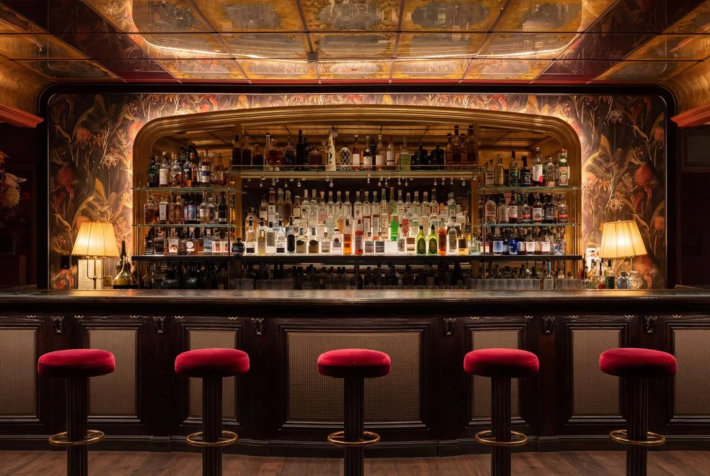 Red cocktail bar with velvet stools